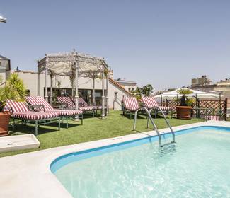 Pool mit sonnenterrasse Hotel ILUNION Mérida Palace Pool mit sonnenterrasse Hotel ILUNION Mérida Palace